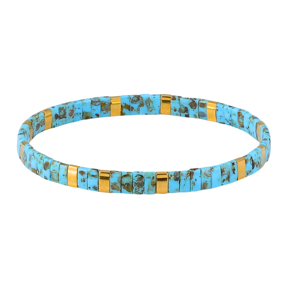 Turquoise and gold beaded bracelet on a white background