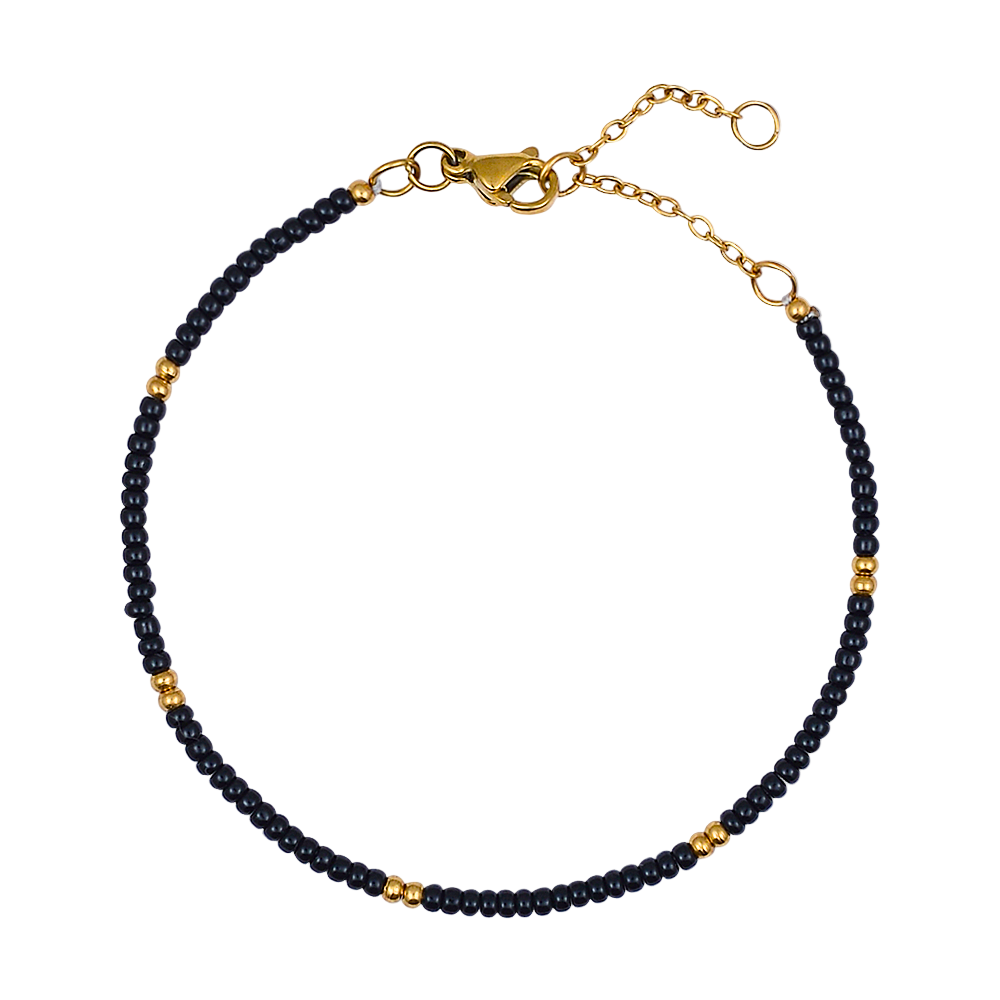 Black beaded bracelet with gold accents on a white background