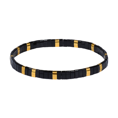 Black and gold beaded bracelet on a white background