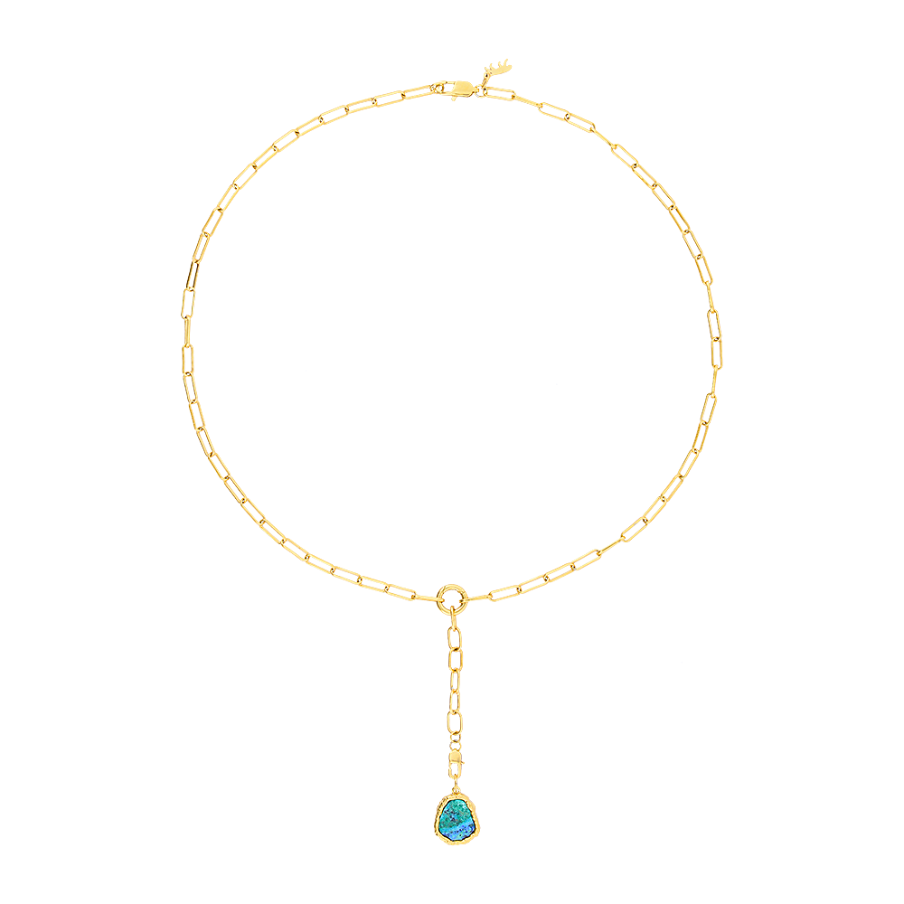 Gold necklace with a turquoise pendant on a white background