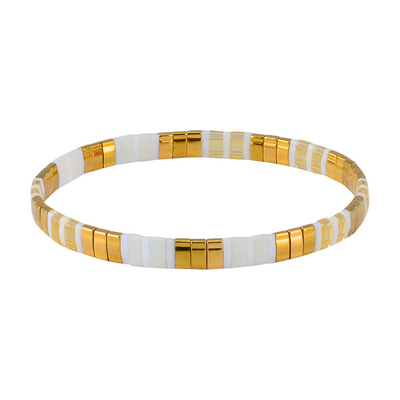 Bracelet with gold and white beads on a white background