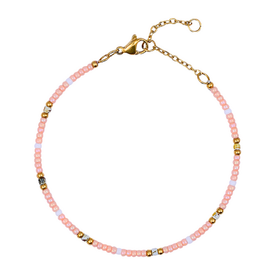 Bracelet with pink and gold beads on a white background